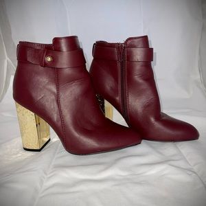Size 6 burgundy bootie with gold heel. Purchase from boutique, brand unknown.